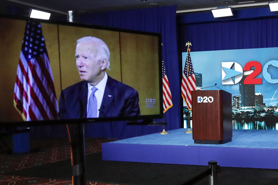 Images of Democratic presidential candidate former Vice President Joe Biden are shown on a screen during the final night of the virtual 2020 Democratic National Convention, Thursday, Aug. 20, 2020 in Milwaukee, Wisc. (Kamil Krzaczynski/Pool via AP)