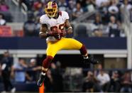 ARLINGTON, TX - NOVEMBER 22: Pierre Garcon #88 of the Washington Redskins pulls in a touchdown pass against the Dallas Cowboys on Thanksgiving Day at Cowboys Stadium on November 22, 2012 in Arlington, Texas. (Photo by Tom Pennington/Getty Images)