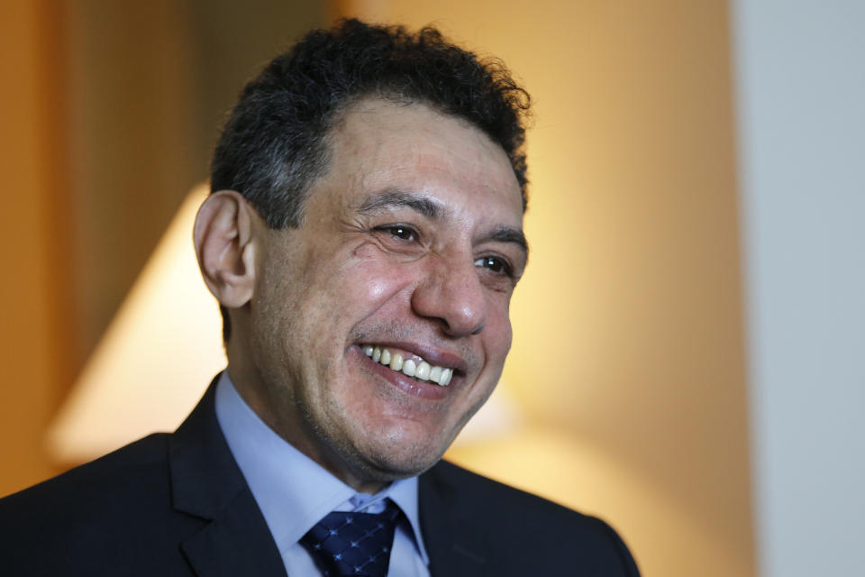 Nizar Zakka a Lebanese citizen and permanent U.S. resident who was released in Tehran after nearly four years in jail on charges of spying, smiles during an interview with The Associated Press at a hotel in Dbayeh, north of Beirut, Lebanon, Wednesday, June 12, 2019. Zakka, an information technology expert, who was detained in Iran in September 2015 while trying to fly out of Tehran called on President Donald Trump to "get back your hostages" from Iran. He was sentenced to 10 years in prison after authorities accused him of being an American spy - allegations vigorously rejected by Zakka, his family and associates. (AP Photo/Bilal Hussein)