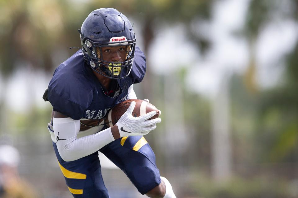 Naples’ Jonas Duclona intercepts a pass during football practice, Tuesday, Aug. 9, 2022, at Naples High School in Naples, Fla.