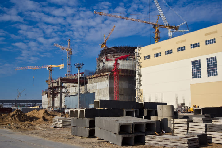 The construction of a large-scale nuclear power plant.