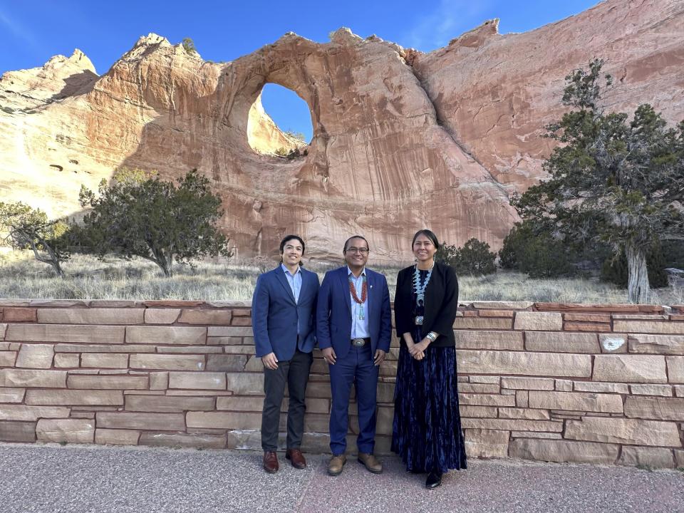 This March 9, 2023 image provided by the U.S. Energy Department shows PaaWee Rivera, left, director of tribal affairs and senior advisor to the White House Office of Intergovernmental Affairs, Navajo Nation President Buu Nygren, center, and Office of Indian Energy Director Wahleah Johns posing for a photograph in Window Rock, Arizona. The officials gathered in the Navajo Nation capitol to discuss a memorandum of understanding aimed at helping the tribe transition to renewable energy. (U.S. Department of Energy via AP)