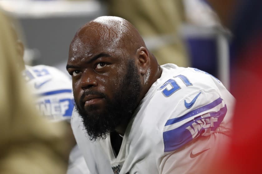 Detroit Lions defensive tackle A'Shawn Robinson sits on the bench during the second half of an NFL football game against the Dallas Cowboys, Sunday, Nov. 17, 2019, in Detroit. (AP Photo/Rick Osentoski)