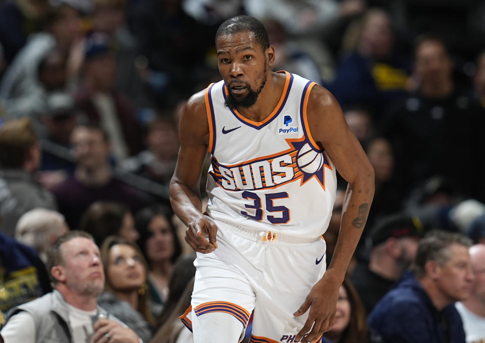 Phoenix Suns forward Kevin Durant gestures after hitting a 3-point basket against the Denver Nuggets in overtime of an NBA basketball game Tuesday, March 5, 2024, in Denver. (AP Photo/David Zalubowski)