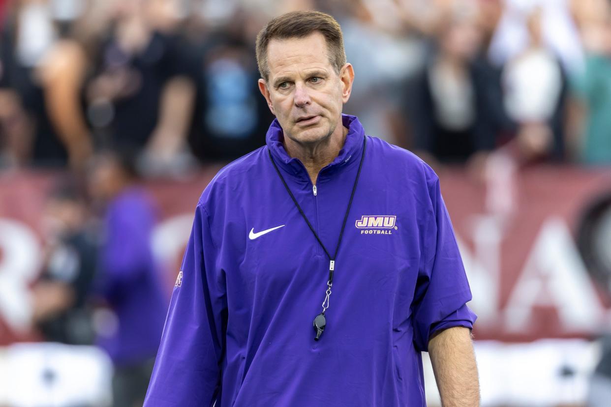 James Madison head coach Curt Cignetti watches his team warm up before the first half of an NCAA college football game against Troy, Saturday, Sept. 16, 2023, in Troy, Ala. (AP Photo/Vasha Hunt)