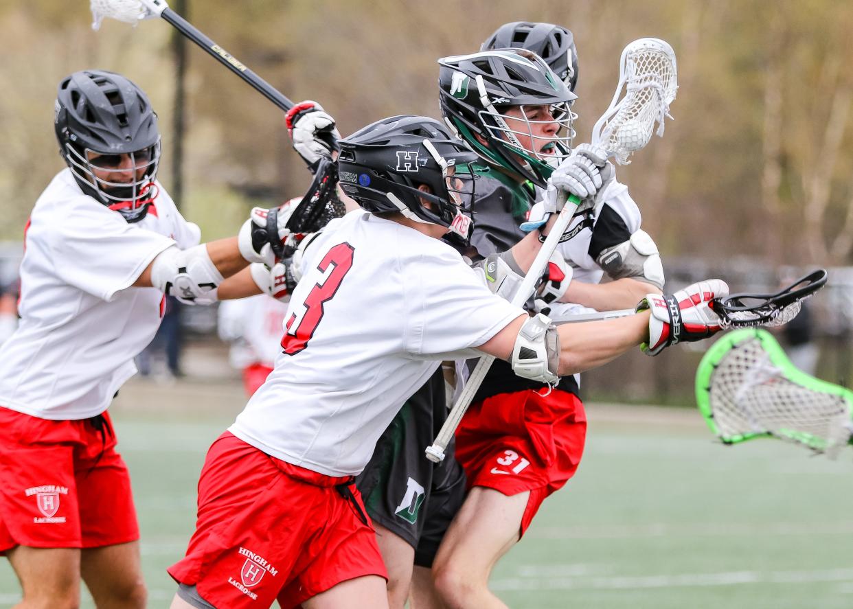 Duxbury's Braeden Hulett is defended by Hingham's Rocco Egan during a game at Hingham High School on Tuesday, April 30, 2024.