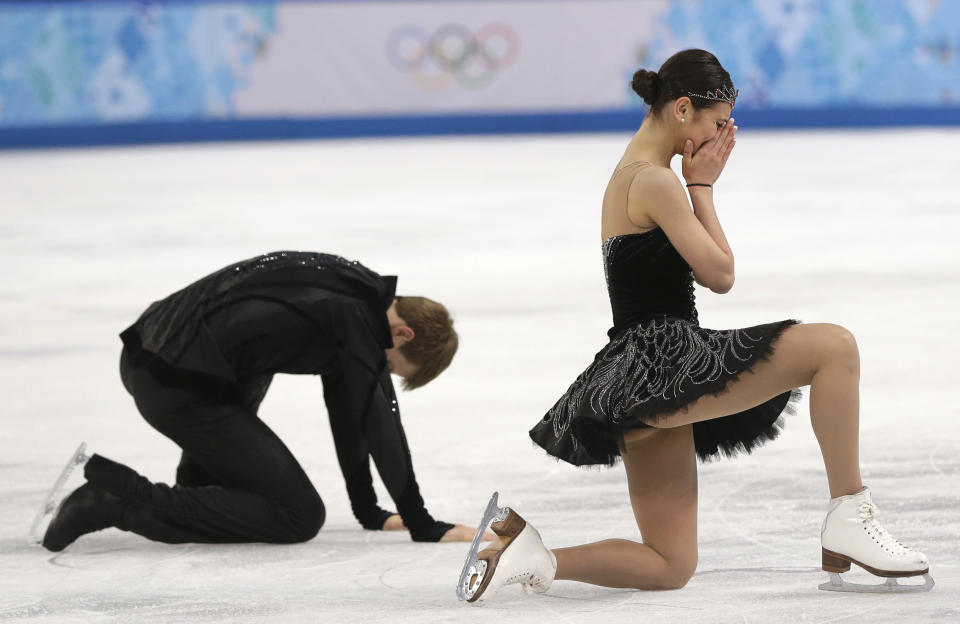 Elena Ilinykh and Nikita Katsalapov of Russia react as they complete their routine in the ice dance free dance figure skating finals at the Iceberg Skating Palace during the 2014 Winter Olympics, Monday, Feb. 17, 2014, in Sochi, Russia. (AP Photo/Darron Cummings)