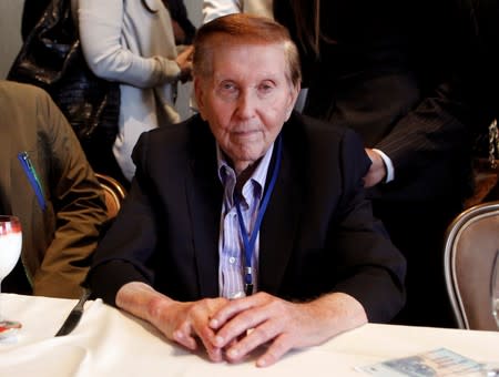 FILE PHOTO: Redstone poses for a photo at the Milken Institute Global Conference in Beverly Hills, California