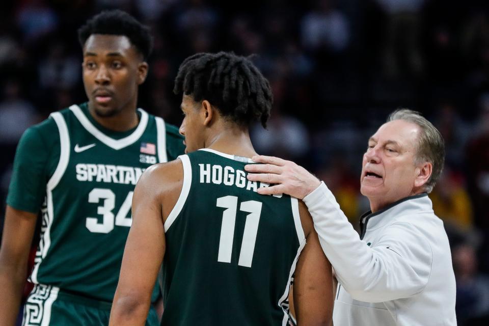 Michigan State head coach Tom Izzo talks to forward Xavier Booker (34) and guard A.J. Hoggard (11) during the second half of quarterfinal of Big Ten tournament at Target Center in Minneapolis, Minn. on Friday, March 15, 2024.