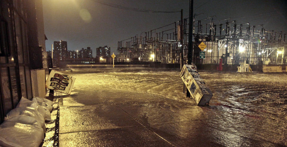 Streets around a Con Edison substation are flooded as the East River overflows into the Dumbo section of Brooklyn, N.Y., as Sandy moves through the area on Monday, Oct. 29, 2012. After a gigantic wall of water defied elaborate planning and swamped underground electrical equipment at a Consolidated Edison substation in Manhattan's East Village, about 250,000 lower Manhattan customers were left without power. (AP Photo/Bebeto Matthews)