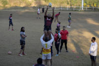 Rugby players of a local club 'Islamabad Jinns' take part in a practice session, in Islamabad, Pakistan, Saturday, Dec. 17, 2022. There is only one sport that matters in Pakistan and that's cricket, a massive money-making machine. But minors sports like rugby are struggling to get off the ground due to lack of investment and interest, stunting their growth at home and chances of success overseas. Even previously popular sports like squash and field hockey, which Pakistan dominated for decades, can't find their form. (AP Photo/Anjum Naveed)