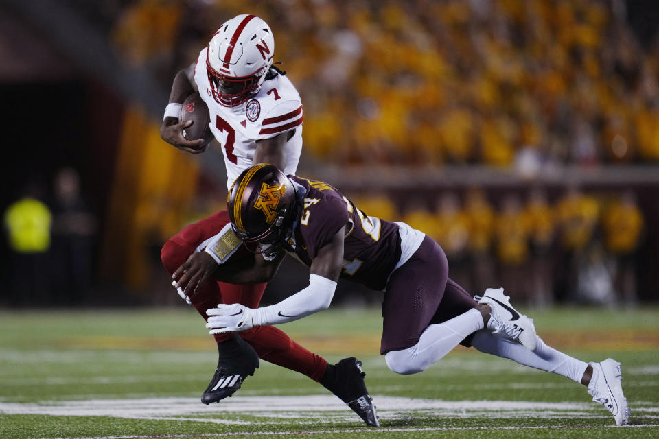 Nebraska quarterback Jeff Sims (7) is tackled by Minnesota defensive back Tariq Watson during the second half of an NCAA college football game Thursday, Aug. 31, 2023, in Minneapolis. (AP Photo/Abbie Parr)