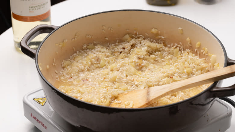 rice and onions in pan