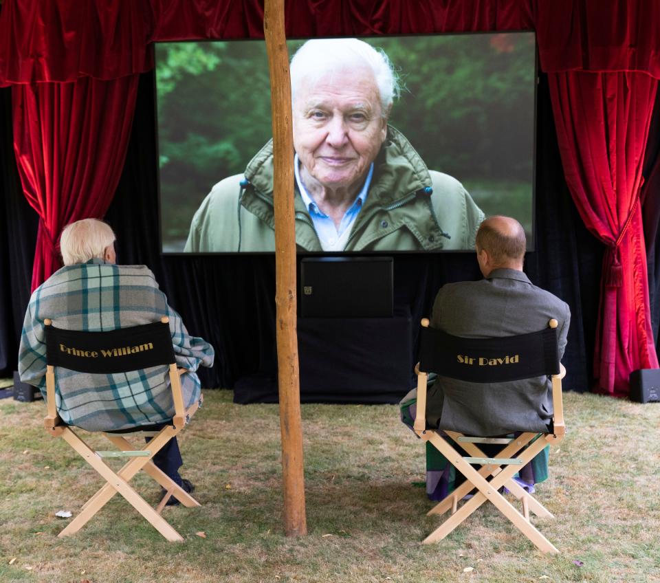 British nature filmmaker Sir David Attenborough gave Prince William a private screening of his latest film in the garden of Kensington Palace, in a photo released Sept. 26, 2020.