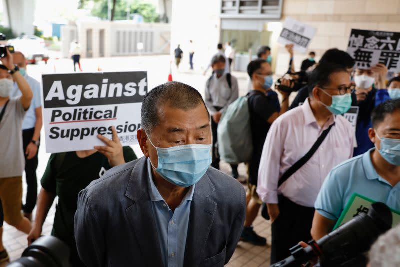 Media tycoon Jimmy Lai arrives at the West Kowloon Courts before entering a courtroom to face charges related to illegal assembly during Tiananmen vigil, in Hong Kong