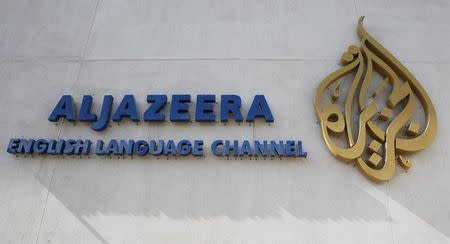 The logo of Qatar-based Al Jazeera satellite news channel is seen in Doha February 7, 2011. REUTERS/ Fadi Al-Assaad