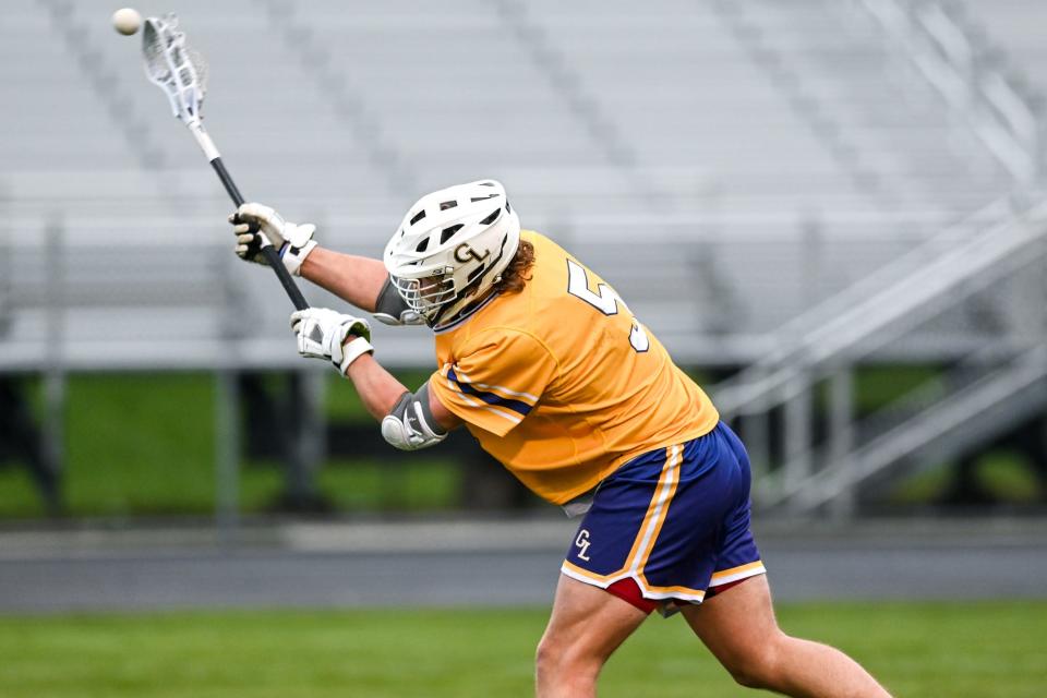 Grand Ledge's Landon Parker takes a shot at the goal against Holt during the first half on Tuesday, May 2, 2023, at Holt High School.