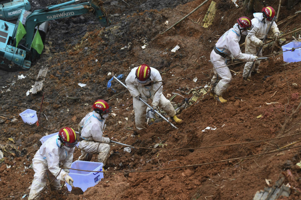 CORRECTS NUMBER OF THE VICTIMS - In this photo released by Xinhua News Agency, search and rescuer workers conduct continued search operations at the China Eastern flight crash site in Tengxian County on Saturday, March 26, 2022, in southern China's Guangxi Zhuang Autonomous Region. The second "black box" has been recovered from the crash of a China Eastern Boeing 737-800 that killed 132 people last week, Chinese state media said Sunday. (Lu Boan/Xinhua via AP)