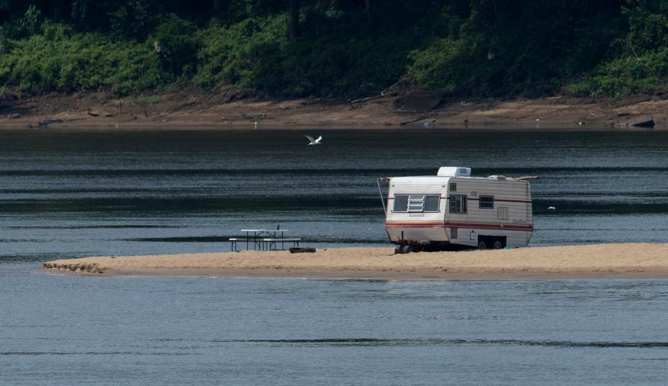 In this July 28 photo, the camper sits on an Ohio River sandbar. Several days later, the Ohio River levels rose, sweeping the camper downstream to Henderson.