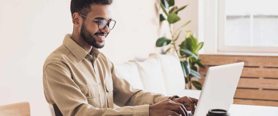 Men student working on computer. Businessman using laptop at home. Internet marketing, freelance work, working at home, online learning, studying, lockdown concept. Distance education