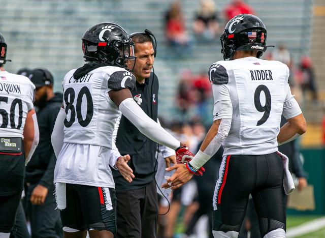 No, Cincinnati Bearcats will not play on a black football field Friday