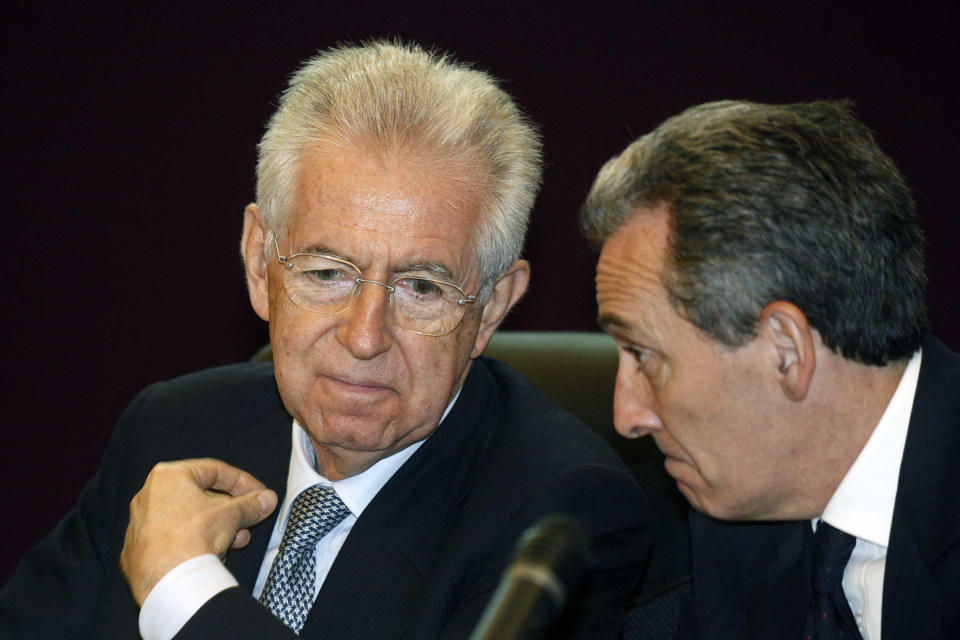 FILE In this May 16, 2012 file photo, Italian Premier Mario Monti, left, talks with Economy vice-minister Vittorio Grilli at a meeting in Rome. Italy's Deputy Finance Minister. On Wednesday, July 11, 2012 Mario Monti relinquished the finance minister's post, handing it over to the ministry's No. 2, Grilli, who already has filled in for Monti at several EU finance ministry meetings so the premier could tend to government matters. (AP Photo/Mauro Scrobogna, Lapresse, file) ITALY OUT