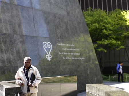 A man walks through the African Burial Ground National Monument in New York in his May 3, 2013 file photo. REUTERS/Brendan McDermid/Files