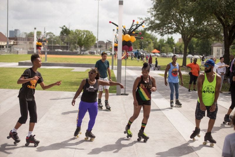 Residents gather to roller skate during 2019 Juneteenth celebrations in Emancipation Park