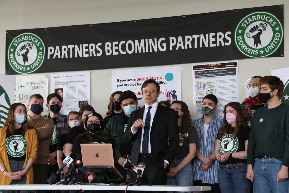 Attorney Ian Hayes and Starbucks workers speak during a news conference to react to a decision by the National Labor Relations Board to postpone a scheduled union vote count in Buffalo, New York, U.S., February 23, 2022. REUTERS/Brendan McDermid