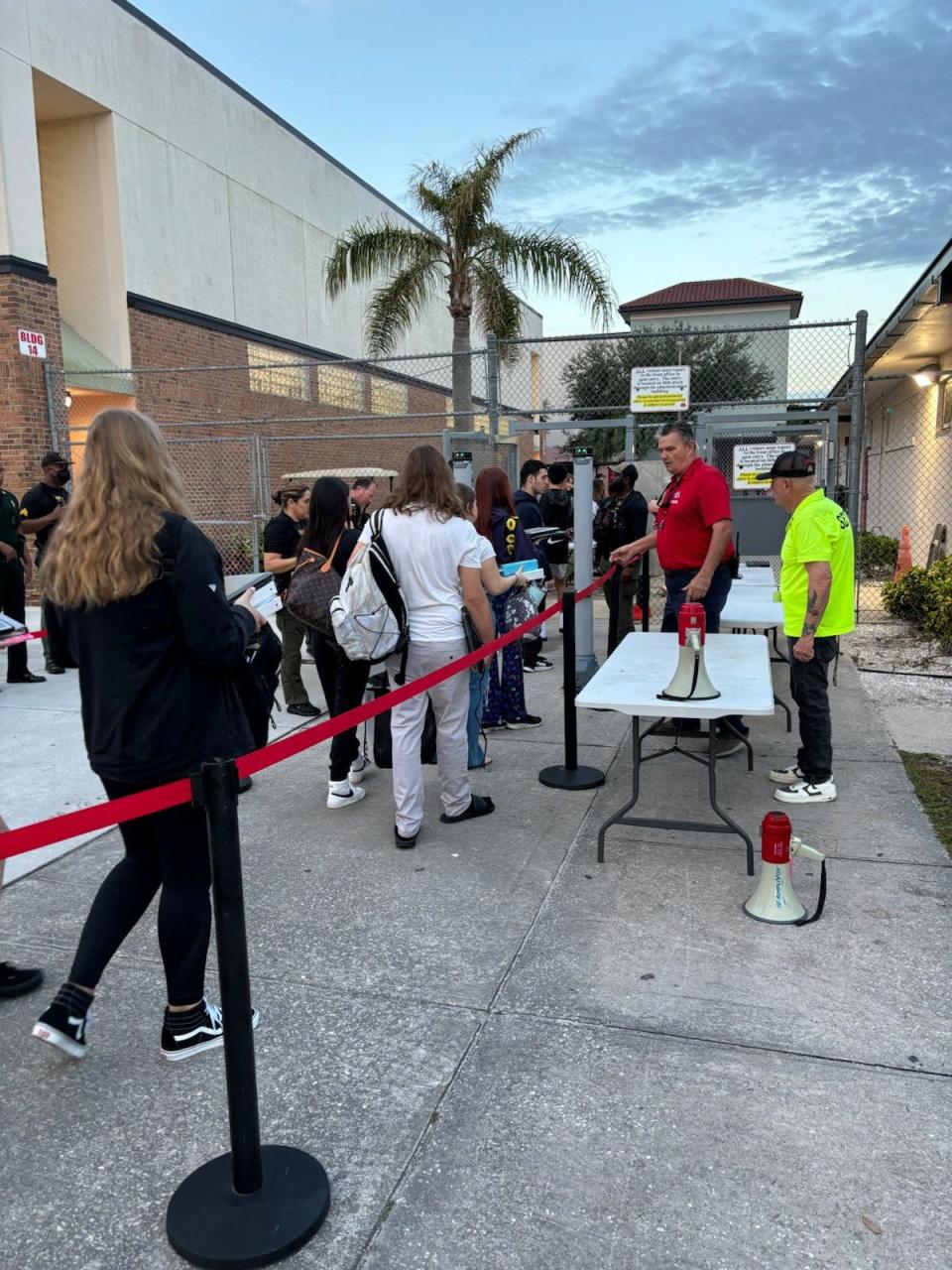 Vero Beach High School students go through metal detectors Friday before school.