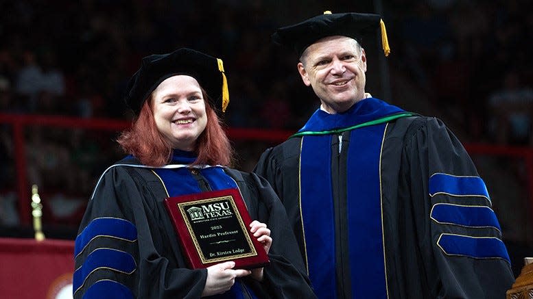 MSU Texas names Dr. Kirsten Lodge, left, to be 2023 Hardin professor during graduation ceremonies Saturday May 13, 2023.  Dr. Keith Lamb, interim university president, is on the right.