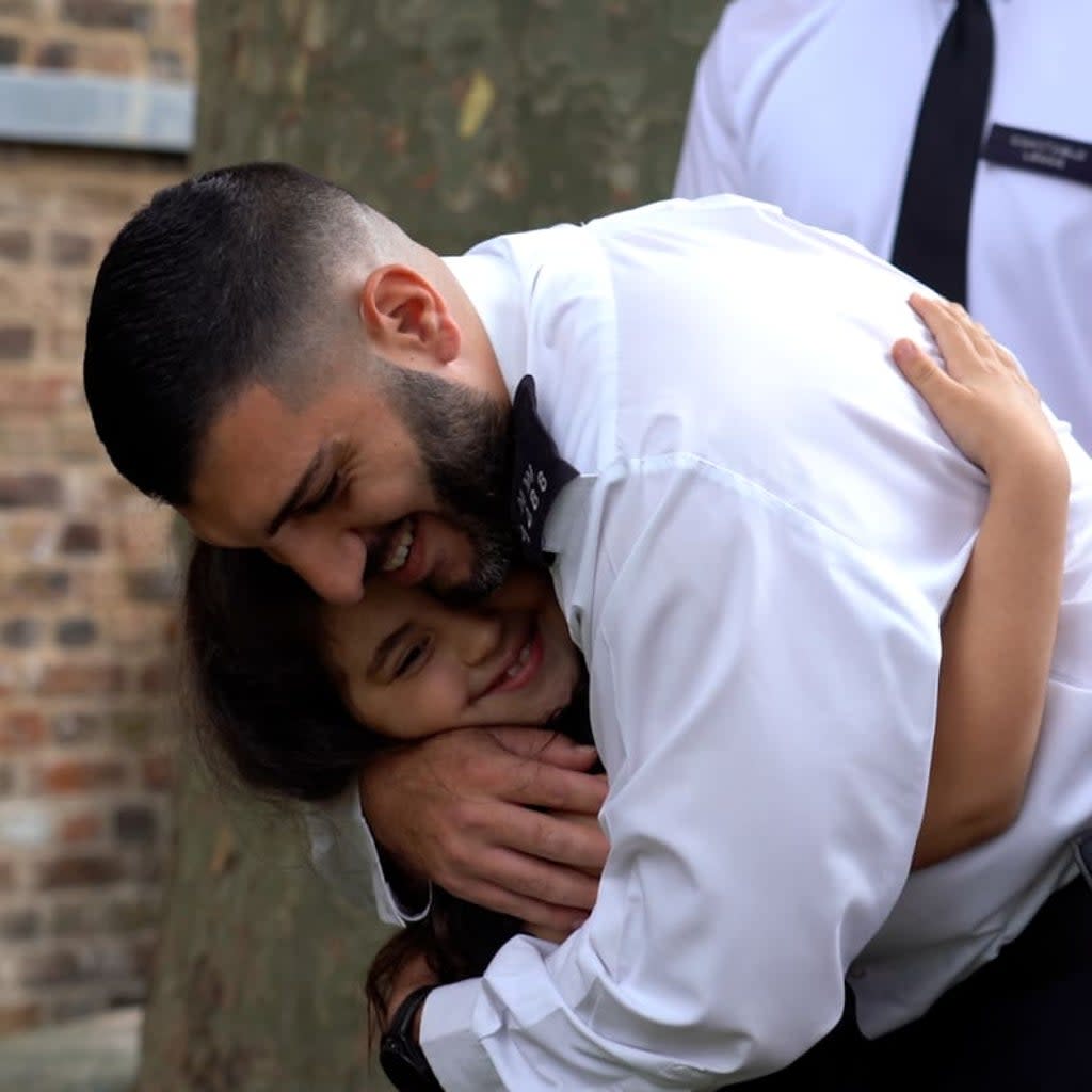 Seven year old Noura was re-united with police officers who saved her life.  (Met police)