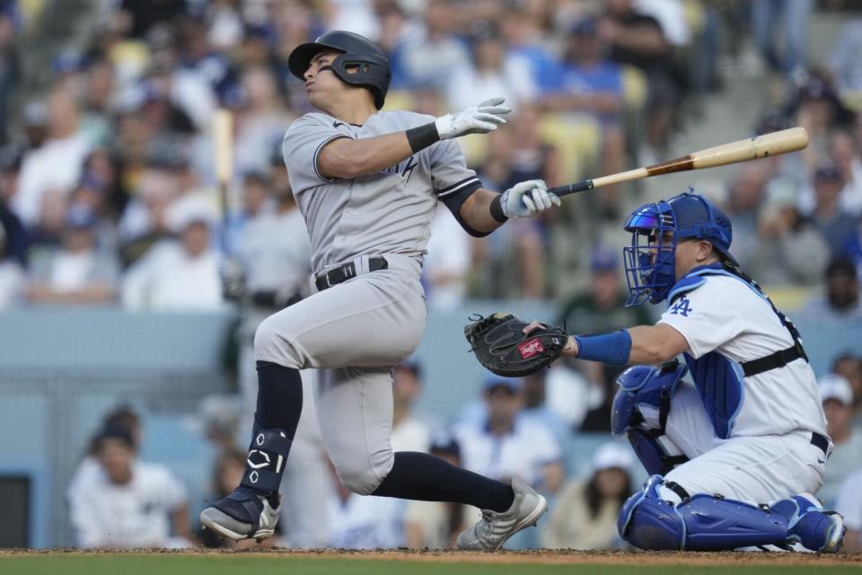 New York Yankees'  Anthony Volpe hits a home run during the ninth inning Sunday against the Dodgers.