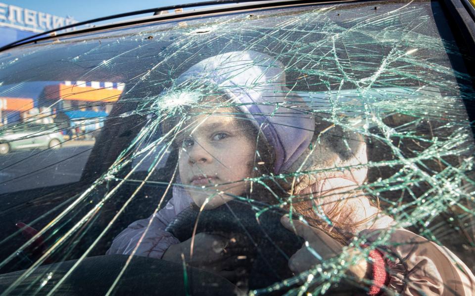 Adele, a refugee from Mauriupol arrives with her family at a makeshift centre in a Zaporizhzhia supermarket car park -  Simon Townsley/ Simon Townsley