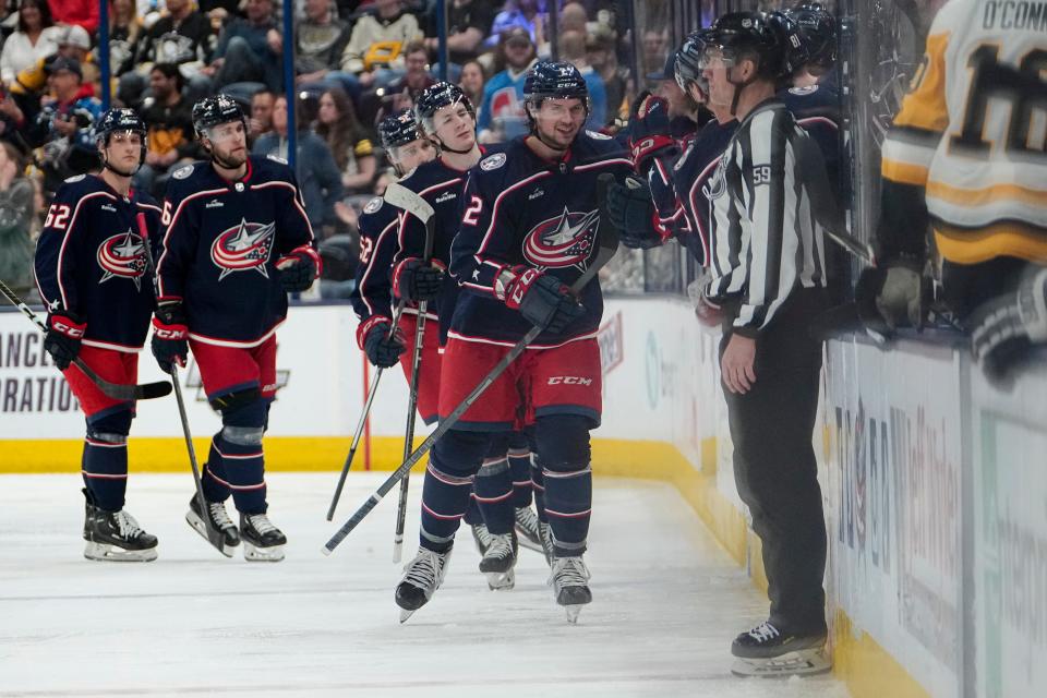 Columbus Blue Jackets defenseman Andrew Peeke (2) celebrates scoring a goal during the second period of the NHL hockey game against the Pittsburgh Penguins at Nationwide Arena on April 13, 2023.