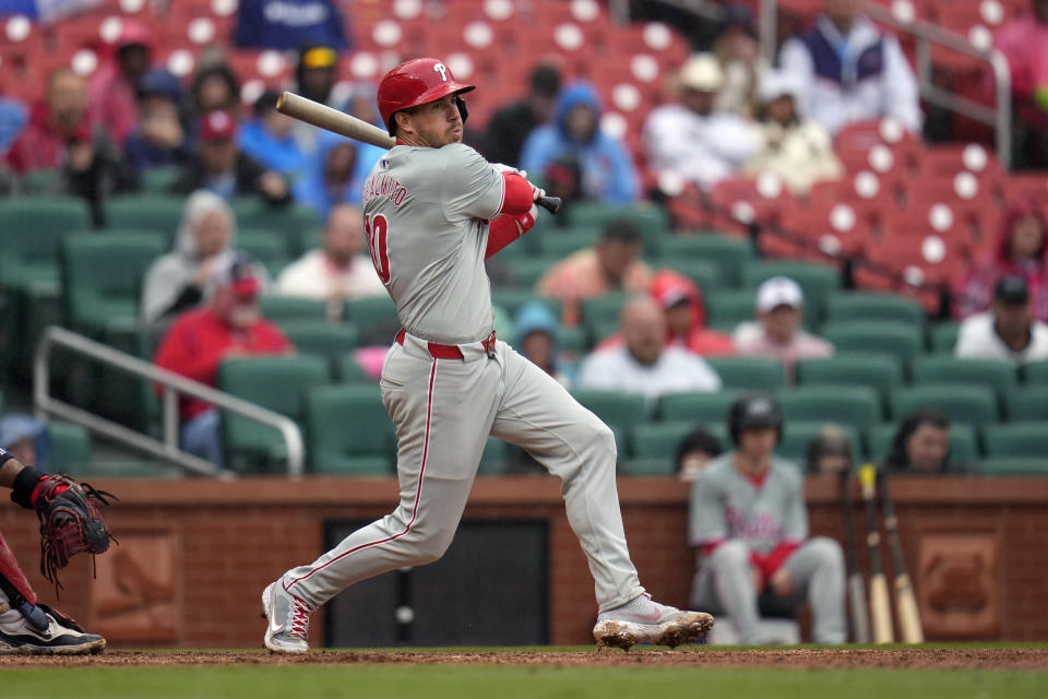 Philadelphia Phillies' J.T. Realmuto follows through on a single during the sixth inning of a baseball game against the St. Louis Cardinals Wednesday, April 10, 2024, in St. Louis. (AP Photo/Jeff Roberson)