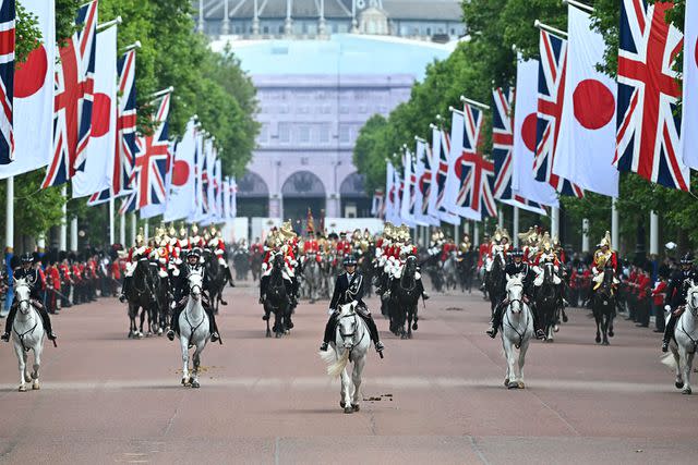 <p>PAUL ELLIS/AFP via Getty Images</p> Police lead the procession down The Mall in London during the Japanese state visit on June 25, 2024.