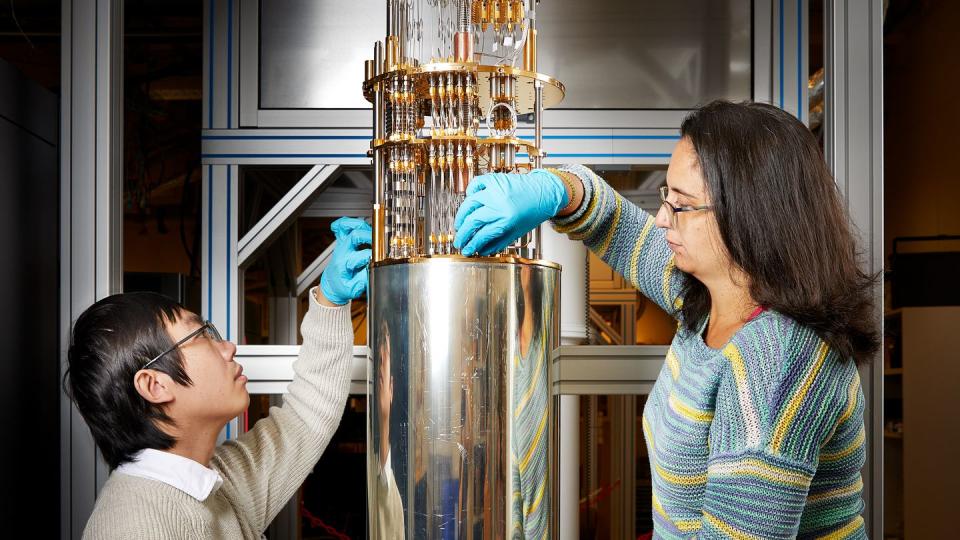 A doctoral student and one of the research leaders with the quantum computer project at Chalmers University of Technology open the last stage of the dilution refrigerator for the school’s quantum computer. (Anna-Lena Lundqvist/Chalmers University of Technology)