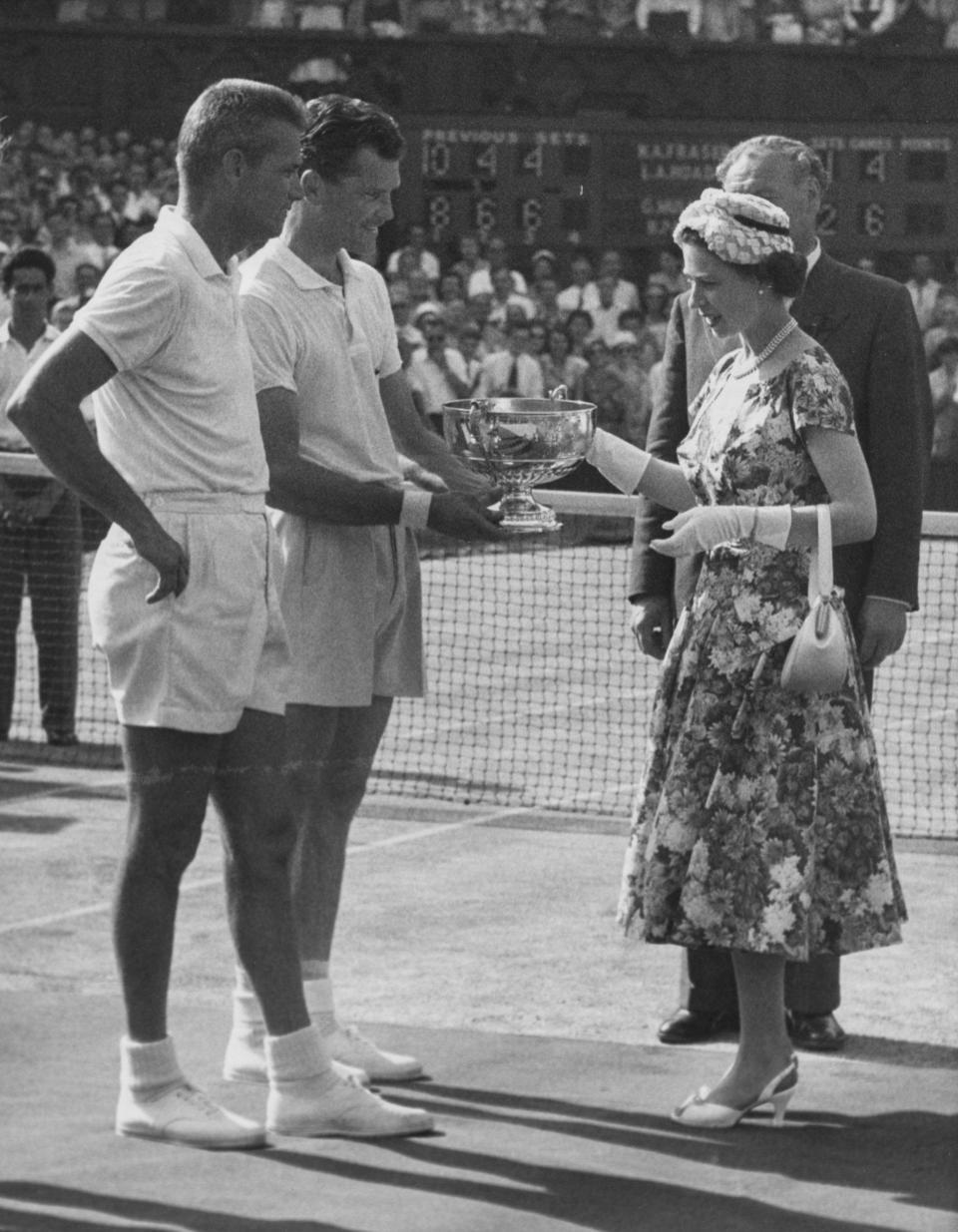 The Queen presents the Wimbledon Men's Doubles trophy to Gardnar Mulloy and Budge Patty, July 1957 - Paul Popper/Popperfoto via Getty Images