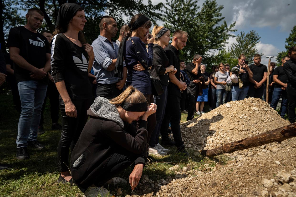 Relatives cry during a funeral ceremony for Ukrainian serviceman Bohdan Kobylianskyi (AP)