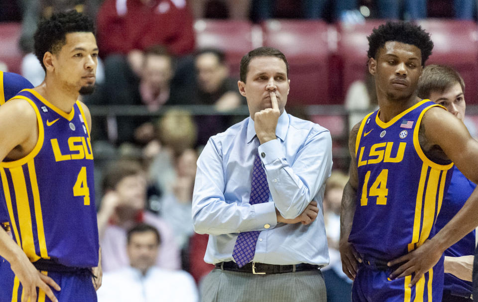 LSU guard Skylar Mays (4), LSU head coach Will Wade and LSU guard Marlon Taylor (14) look on during a referee video review during the first half of an NCAA college basketball game against Alabama, Saturday, March 2, 2019, in Tuscaloosa, Ala. (AP Photo/Vasha Hunt)