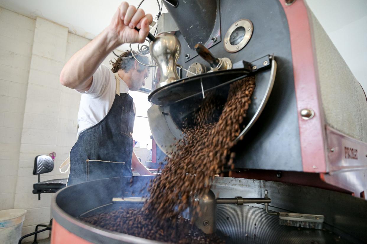 Marcus smith roasts coffee beans on Wednesday at Elemental Coffee in Oklahoma City.