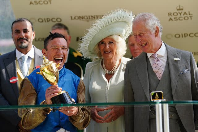 <p>David Davies/PA Images</p> Frankie Dettori celebrates alongside King Charles and Queen Camilla after winning the Gold Cup at the Royal Ascot.