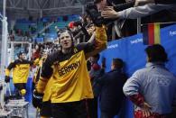 Ice Hockey - Pyeongchang 2018 Winter Olympics - Men Semifinal Match - Canada v Germany - Gangneung Hockey Centre, Gangneung, South Korea - February 23, 2018 - Germany's players high five fans. REUTERS/Brian Snyder