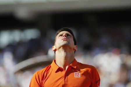 Novak Djokovic of Serbia reacts during his men's final match against Stan Wawrinka of Switzerland at the French Open tennis tournament at the Roland Garros stadium in Paris, France, June 7, 2015. REUTERS/Gonzalo Fuentes