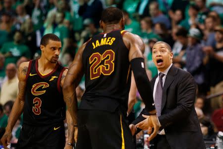 May 23, 2018; Boston, MA, USA; Cleveland Cavaliers head coach Tyronn Lue talks with forward LeBron James (23) and guard George Hill (3) during the fourth quarter against the Boston Celtics in game five of the Eastern conference finals of the 2018 NBA Playoffs at TD Garden. Mandatory Credit: Winslow Townson-USA TODAY Sports