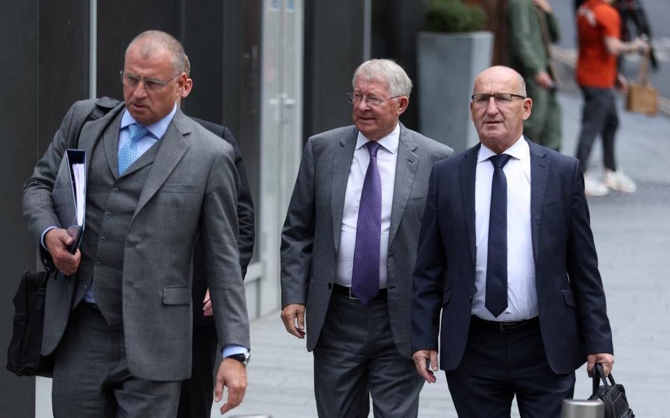 Former Manchester United manager Alex Ferguson arrives at Manchester Crown Court - Carl Recine/Reuters