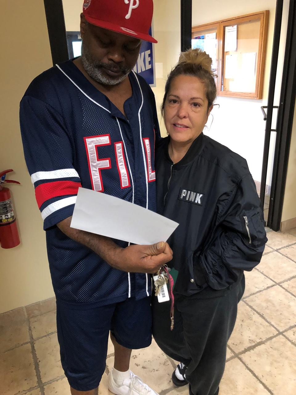 Henry Myles and wife Lauri Myles got his strike wage check at UAW Local 163 in Westland Monday. Henry Myles has worked at GM's Romulus Powertrain plant for three years.