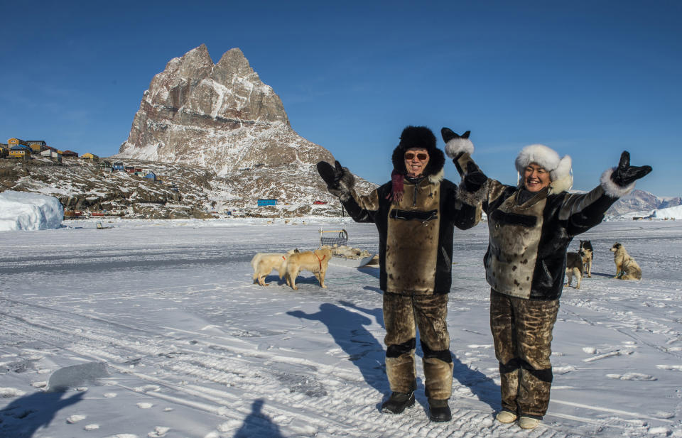 In this Wedensday March 26. 2014 photo, UN Secretary General Ban Ki-moon, left, and Greenlandic Prime Minister Aleqa Hammond, right, on the ice outside the city of Uummannaq, north of the Arctic Circle in West Greenland's Qaasuitsup Municipality. Greenland and Denmark hosted a visit to Greenland by Ban Ki-moon in preparation for the UN Climate Summit which is slated for September 2014 in New York. (AP Photo/POLFOTO, Leiff Josefsen) DENMARK OUT