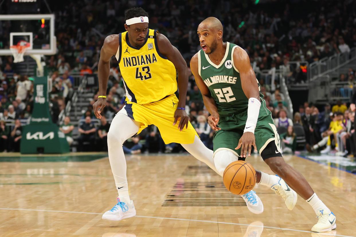 MILWAUKEE, WISCONSIN - APRIL 21: Khris Middleton #22 of the Milwaukee Bucks is defended by Pascal Siakam #43 of the Indiana Pacers during game one of the Eastern Conference First Round Playoffs at Fiserv Forum on April 21, 2024. (Photo by Stacy Revere/Getty Images)